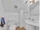 Small bathroom with toilet, sink and a mirror at 1630 Lasbury Ave, Winter Park, FL 32789