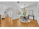 Elegant dining room with hardwood floors, chandelier, and view of the pool area at 1630 Lasbury Ave, Winter Park, FL 32789