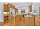 Well-equipped kitchen featuring stainless steel appliances, a center island, and granite countertops at 1630 Lasbury Ave, Winter Park, FL 32789