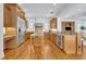 Well-appointed kitchen featuring custom cabinetry, hardwood floors, and stainless steel appliances at 1630 Lasbury Ave, Winter Park, FL 32789