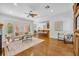 Spacious living room with hardwood floors and open layout, showcasing the dining area and kitchen at 1630 Lasbury Ave, Winter Park, FL 32789