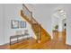 Elegant staircase with wood treads, iron railings, and bench seating at 1630 Lasbury Ave, Winter Park, FL 32789