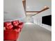 Spacious theater room boasts comfortable red seating and wooden beam details at 1630 Lasbury Ave, Winter Park, FL 32789