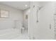 Bathroom with separate soaking tub and walk in shower in neutral color palette at 16300 County Road 455 # 704, Montverde, FL 34756