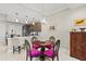 Charming dining area with pendant lighting open to kitchen featuring bar stool seating at 16300 County Road 455 # 704, Montverde, FL 34756