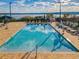 Elevated pool overlooks a large lake surrounded by lounge seating at 16300 County Road 455 # 704, Montverde, FL 34756