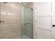 Bathroom featuring a frameless glass shower and neutral walls at 1806 Dixie Belle Dr, Orlando, FL 32812