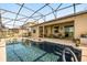 Expansive screened-in pool with a spa and plenty of patio space for entertaining at 1810 Trophy Bass Way, Kissimmee, FL 34746