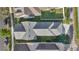 Top-down aerial showcases the house's roof, the property lines, landscaping, and the surrounding neighborhood at 202 Longview Ave, Kissimmee, FL 34747