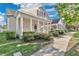 Inviting home exterior with a covered porch, manicured bushes, and a walkway to the front door at 202 Longview Ave, Kissimmee, FL 34747