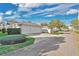 Exterior shot of a two car garage with ample parking space surrounded by greenery at 202 Longview Ave, Kissimmee, FL 34747