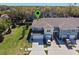 Aerial view of the townhouse, showing the driveway and landscaping at 2037 Canny Cv, Winter Park, FL 32792