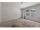 Bright bedroom featuring carpet, windows, and a full length mirror at 2037 Canny Cv, Winter Park, FL 32792