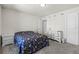 Comfortable bedroom featuring neutral paint, carpet flooring, dresser, and floral bedding at 2037 Canny Cv, Winter Park, FL 32792