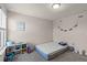 Neutral bedroom featuring a single mattress and shelving at 2037 Canny Cv, Winter Park, FL 32792