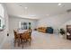 Bright living room area featuring tile flooring, dining area, and view to the patio at 2037 Canny Cv, Winter Park, FL 32792