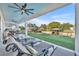 Outdoor back porch with views of the backyard and waterway, complete with lounge chairs at 2072 Starboard Dr, Geneva, FL 32732