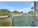 View of the green lawn and canal with covered boat dock of this waterfront property at 2072 Starboard Dr, Geneva, FL 32732