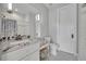 This bright bathroom features a vanity, tile floors, and a shower with a decorative curtain at 2072 Starboard Dr, Geneva, FL 32732