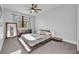 Stylish bedroom with a modern platform bed, a large window with curtains, and a minimalist design at 2072 Starboard Dr, Geneva, FL 32732
