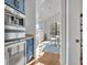 A modern dining room featuring blue cabinets and a window view at 2072 Starboard Dr, Geneva, FL 32732