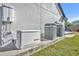 Exterior view of a home featuring a Generac generator and two A/C units, providing modern conveniences at 2072 Starboard Dr, Geneva, FL 32732