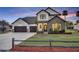 Elegant two-story home with a three-car garage, stone accents, and manicured landscaping at 2072 Starboard Dr, Geneva, FL 32732
