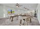 Bright game room includes foosball and air hockey tables, comfortable seating, and ample space for Gathering fun at 2072 Starboard Dr, Geneva, FL 32732