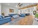 Bright, open living room flowing into the kitchen featuring hardwood floors and ample seating at 2072 Starboard Dr, Geneva, FL 32732