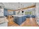 Open-concept living space with a modern kitchen island and a view of the comfortable and cozy living room at 2072 Starboard Dr, Geneva, FL 32732