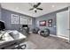 Well-lit home office featuring built-in shelving, comfortable seating, and a calming color scheme for productivity at 2072 Starboard Dr, Geneva, FL 32732