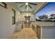 An outdoor kitchen with stainless steel grill, granite counters and a beverage center, perfect for entertaining at 2072 Starboard Dr, Geneva, FL 32732