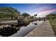 Waterfront home with dock, covered boat lift, and calm canal views under a beautiful dusk sky at 2072 Starboard Dr, Geneva, FL 32732