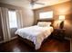 Relaxing bedroom featuring a queen bed, wood floors, and light colored walls at 2211 Oberlin Ave, Orlando, FL 32804