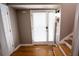 Foyer area with natural wood floors, staircase, and entry to living area at 2211 Oberlin Ave, Orlando, FL 32804