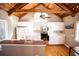 Modern kitchen featuring white cabinets and appliances with vaulted wood ceiling at 2211 Oberlin Ave, Orlando, FL 32804