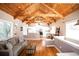 Living room features a wood beamed ceiling, lots of natural light, and is open to the kitchen at 2211 Oberlin Ave, Orlando, FL 32804