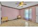 Bedroom featuring tile flooring and a standard ceiling fan at 2215 Mallard Creek Cir, Kissimmee, FL 34743