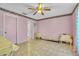 Empty bedroom with tile flooring, pink walls and standard ceiling fan at 2215 Mallard Creek Cir, Kissimmee, FL 34743