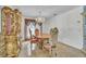 Formal dining room with an ornate table set, chandelier, and display cabinet at 2215 Mallard Creek Cir, Kissimmee, FL 34743