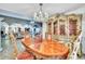 Dining room adjacent to living area with stunning chandelier, cabinet, and exquisite chairs at 2215 Mallard Creek Cir, Kissimmee, FL 34743