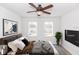 Bright bedroom with a comfortable bed, a large window, and a modern television at 2217 Wekiva Reserve Blvd, Apopka, FL 32703