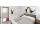 Cozy bedroom with neutral decor, a comfortable bed, and an open doorway to another room at 2217 Wekiva Reserve Blvd, Apopka, FL 32703