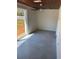 Bedroom features tile flooring, a ceiling fan, sliding glass door to a deck, and neutral paint at 2380 Corbett Rd, Orlando, FL 32826