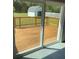 View of large wood deck, backyard, and shed through sliding glass door at 2380 Corbett Rd, Orlando, FL 32826