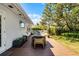 Backyard deck perfect for outdoor dining and entertaining with an adjacent landscaped yard at 2424 Shrewsbury Rd, Orlando, FL 32803