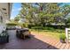 Wooden deck with outdoor seating overlooks expansive, lush backyard at 2424 Shrewsbury Rd, Orlando, FL 32803