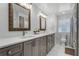 Stylish bathroom featuring a double vanity with gray cabinets and ample counter space at 2424 Shrewsbury Rd, Orlando, FL 32803