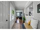 Bright foyer with hardwood floors, white walls, and view into the living room at 2424 Shrewsbury Rd, Orlando, FL 32803