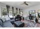 Cozy living room featuring large windows, ample natural light, and comfortable seating area at 2424 Shrewsbury Rd, Orlando, FL 32803